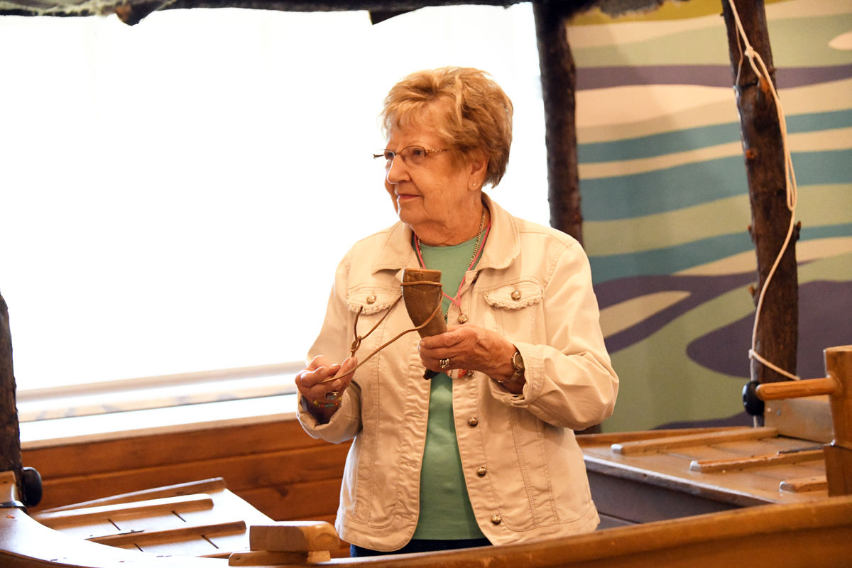 082 Elsie Goertzen examines the powder horn on display in the Mead Center.JPG